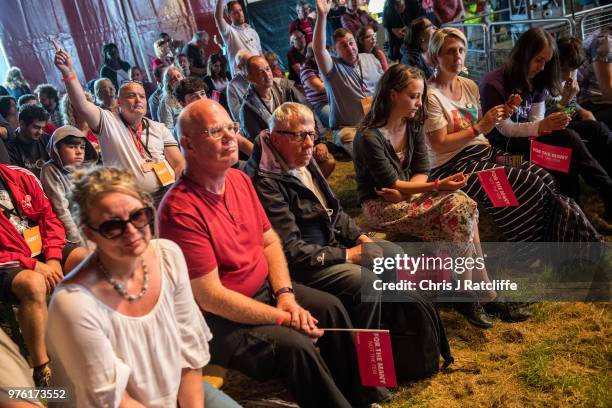 Festival attendees watch General Secretary of Unite the Union, Len McCluskey, speaking on stage at the Solidarity Tent at Labour Live, White Hart...