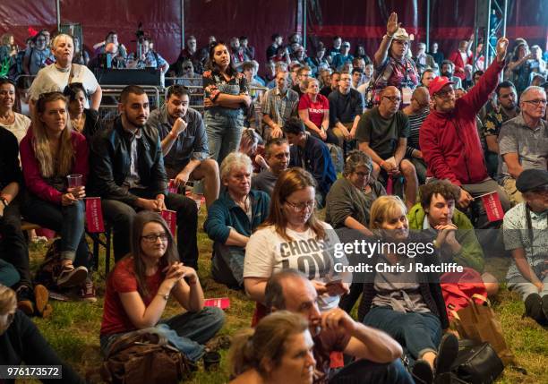 Festival attendees watch General Secretary of Unite the Union, Len McCluskey, speaking on stage at the Solidarity Tent at Labour Live, White Hart...