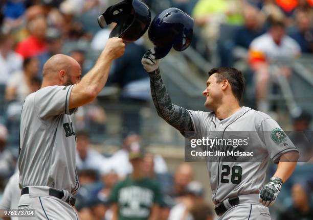 Davis of the Houston Astros celebrates his second inning three run home run against the New York Yankees with teammate Evan Gattis at Yankee Stadium...