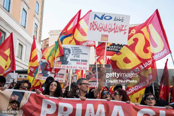 Demonstrators protest during a march 'Prima gli sfruttati' organized by Italy's USB against the murder of the USB syndicalist Soumaila Sacko and the...