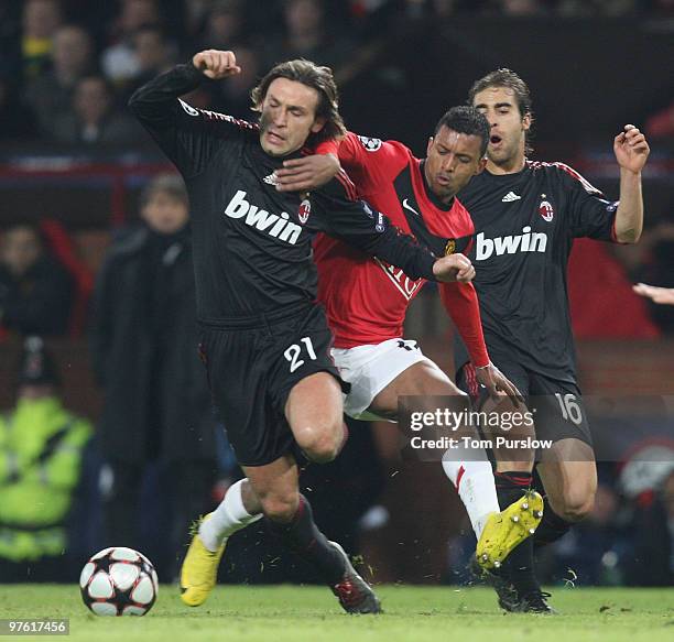 Nani of Manchester United clashes with Andrea Pirlo of AC Milan during the UEFA Champions League First Knockout Round Second Leg match between...