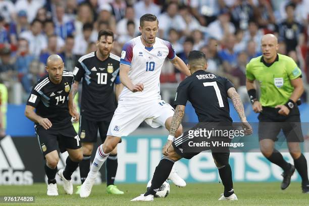 Javier Mascherano of Argentina, Lionel Messi of Argentina, Gylfi Por Sigurdsson of Iceland, Ever Banega of Argentina, referee Szymon Marciniak during...