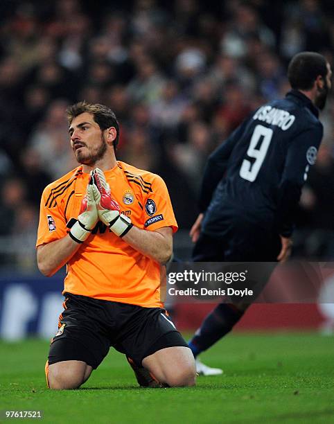 Iker Casillas of Real Madrid reacts after Olympique Lyonnais scored their first goal during the UEFA Champions League round of 16 2nd leg match...