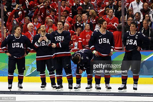 Jack Johnson Tim Gleason, Erik Johnson, Zach Parise, Ryan Malone and Jamie Langenbrunner of USA look on after losing their match in the ice hockey...