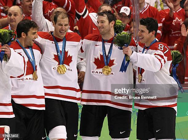 Patrice Bergeron, Ryan Getzlaf, Rick Nash and Sidney Crosby of Canada celebrate after the ice hockey men's gold medal game between USA and Canada on...