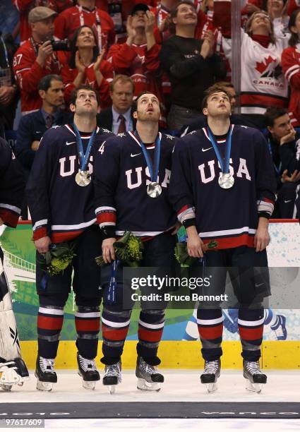 David Backes Brooks Orpik and Bobby Ryan of USA look up at the scoreboard after the ice hockey men's gold medal game between USA and Canada on day 17...