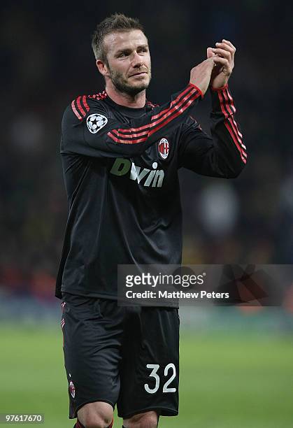 David Beckham of AC Milan applauds the fans after the UEFA Champions League First Knockout Round Second Leg match between Manchester United and AC...