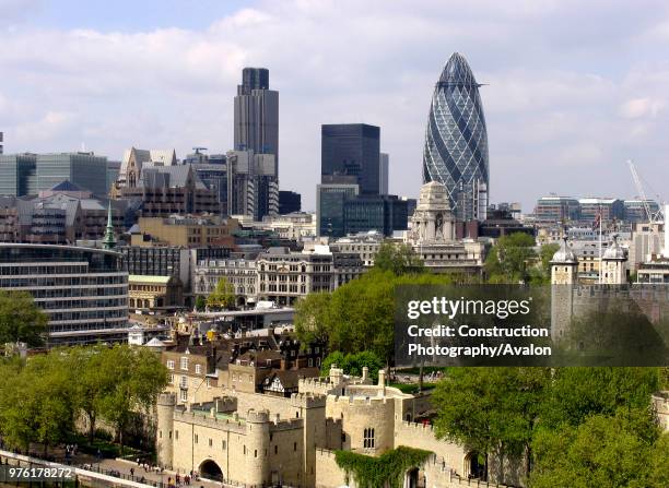 View of City of London with Gherkin and Tower of London, London, UK.
