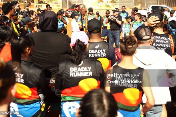 Robert de Castella speaks to competitors in the Mutitjulu community as they prepare to compete in the Uluru Relay Run as part of the National Deadly...