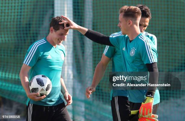 Sebastian Rudy, Mats Hummels and Marc-Andre Ter Stegen of Germany joke around during the Germany Training Session at Luzhniki Stadium on June 16,...