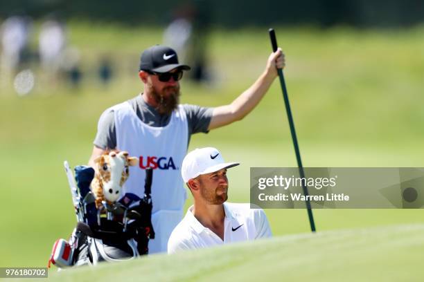 Kevin Chappell of the United States putts on the second green as caddie Joseph Greiner during the third round of the 2018 U.S. Open at Shinnecock...