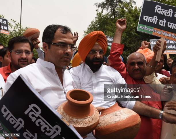 West Delhi Member of Parliament Parvesh Verma and BJP MLA from Rajouri Garden Manjinder Singh Sirsa with party workers and supporters protest against...