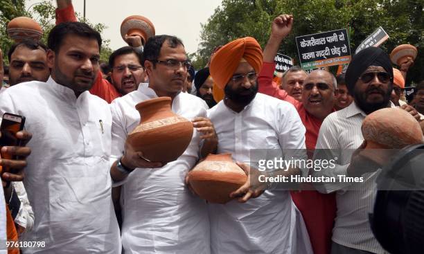 West Delhi Member of Parliament Parvesh Verma and BJP MLA from Rajouri Garden Manjinder Singh Sirsa with party workers and supporters protest against...