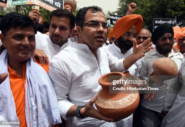 West Delhi Member of Parliament Parvesh Verma and BJP MLA from Rajouri Garden Manjinder Singh Sirsa with party workers and supporters protest against...