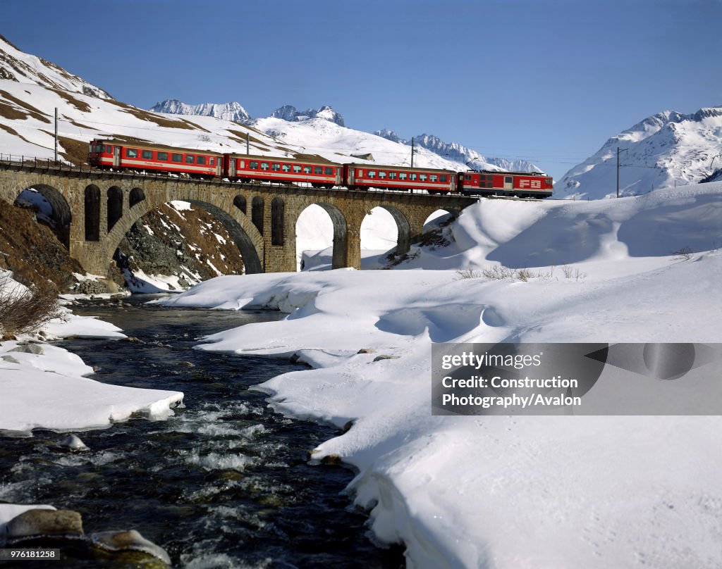 Local Train in Winter Scenery (Track of the Glacier Express) - Swiss Alps - Canton of Uri - Switzerland
