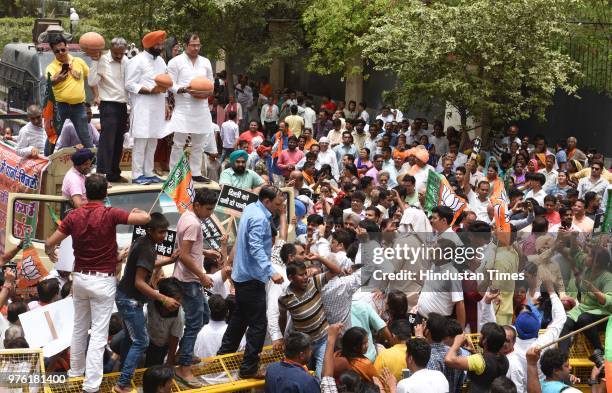 West Delhi Member of Parliament Parvesh Verma and BJP MLA from Rajouri Garden Manjinder Singh Sirsa with party workers and supporters protest against...