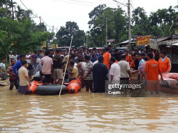 Indian National Disaster Response Force personnel rescue residents due to heavy downpour in Kailasahar, some 156 km north of Agartala, the capital of...