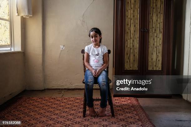 Syrian orphan 4th grade student Joudi Amari who fled from her country due to ongoing civil war and continue to live in Turkey with her mother is seen...