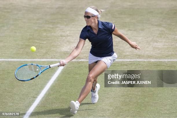 Kirsten Flipkens from Belgium hits the ball during the match against Slovak Viktoria Kuzmova during the semi final of the women's single tennis match...