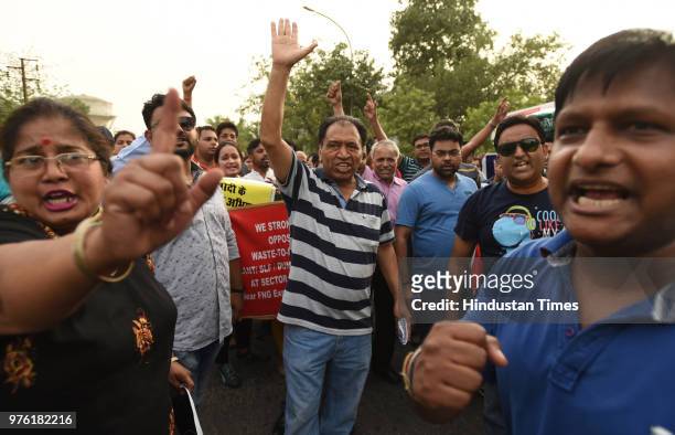 Residents and villagers during a protest march against dumping ground at sector 123, on June 16, 2018 in Noida, India. The National Green Tribunal...