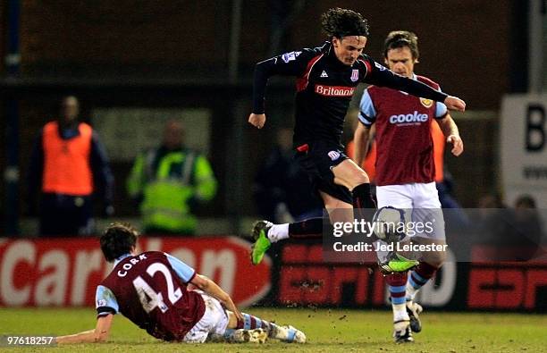 Tuncay Sanli of Stoke City jumps over the tackle from Jack Cork of Stoke City during the Barclays Premier League match between Burnley and Stoke City...