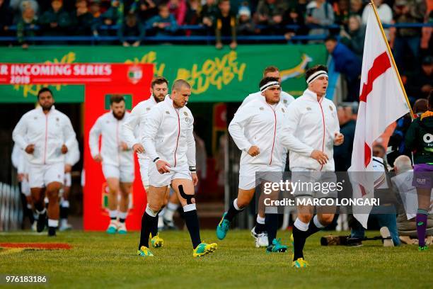 England's fullback Mike Brown and his teammates enter the field during the second test match South Africa vs England at the Free State Stadium in...