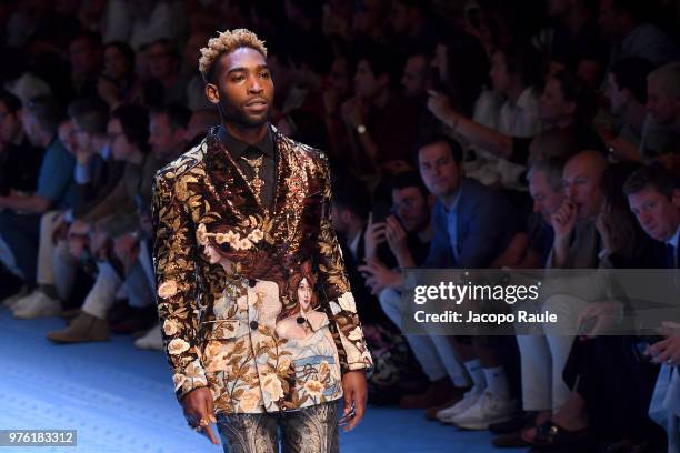 Tinie Tempah walks the runway at the Dolce & Gabbana show during Milan Men's Fashion Week Spring/Summer 2019 on June 16, 2018 in Milan, Italy.