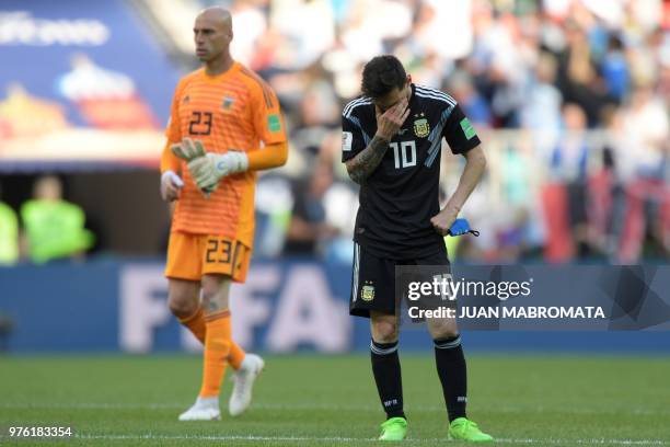 Argentina's forward Lionel Messi reacts at the end of the Russia 2018 World Cup Group D football match between Argentina and Iceland at the Spartak...