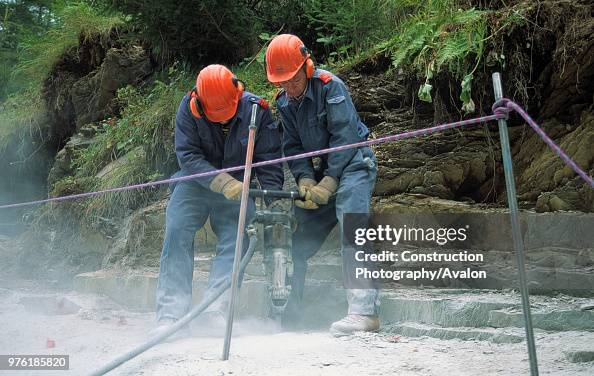 Construction Workers using a Jackhammer Construction Workers using a Jackhammer