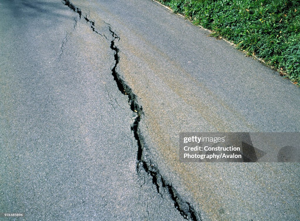 Gap cutting through paved road following an earthquake