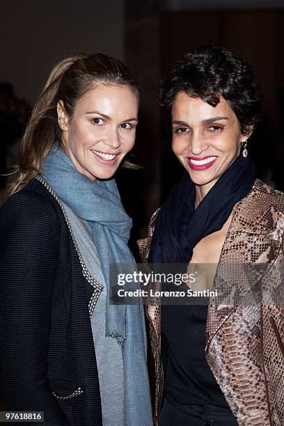 Elle MacPherson and Farida Khelfa attend the Yves Saint Laurent Exhibition at Le Petit Palais on March 10, 2010 in Paris, France.