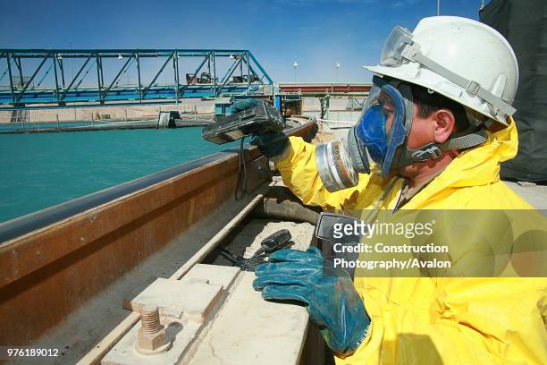 Man checking sulfuric acid.