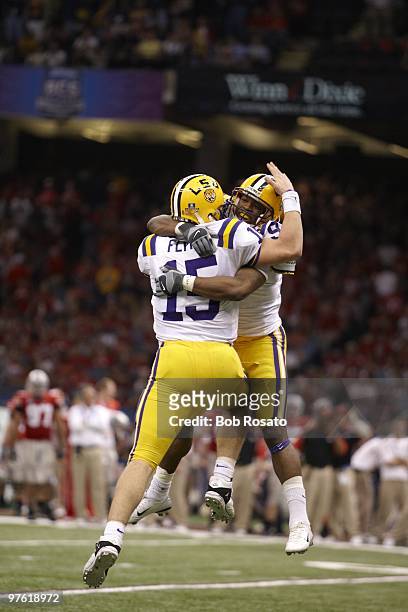 National Championship: Louisiana State QB Matt Flynn victorious with Early Doucet after scoring touchdown during game vs Ohio State. New Orleans, LA...