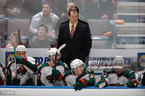 Head Coach Todd Richards with James Sheppard and Chuck Kobasew of the Minnesota Wild watch the action against the Edmonton Oilers on March 5, 2010 at...