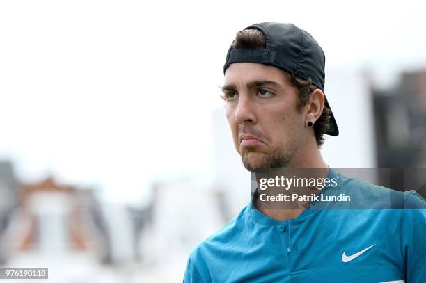 Thanasi Kokkinakis of Australia shows the referee a sad face after a line call during the qualifying match against Pierre-Hugues Herbert of France...