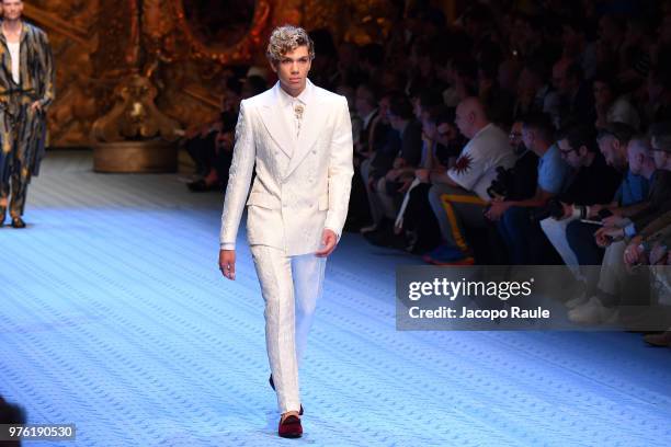 Elias Becker walks the runway at the Dolce & Gabbana show during Milan Men's Fashion Week Spring/Summer 2019 on June 16, 2018 in Milan, Italy.