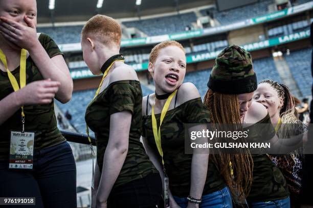 Artists "Bob 90 and the Binos" wait backstage to perform at the 2018 National Youth Day Commemoration under the theme, 'Live the legacy: Towards a...