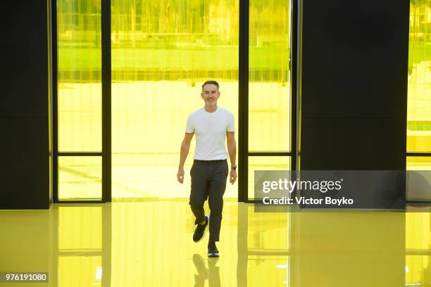 Designer Neil Barrett acknowledges the applause of the audience at the Neil Barrett show during Milan Men's Fashion Week Spring/Summer 2019 on June...