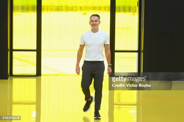 Designer Neil Barrett acknowledges the applause of the audience at the Neil Barrett show during Milan Men's Fashion Week Spring/Summer 2019 on June...