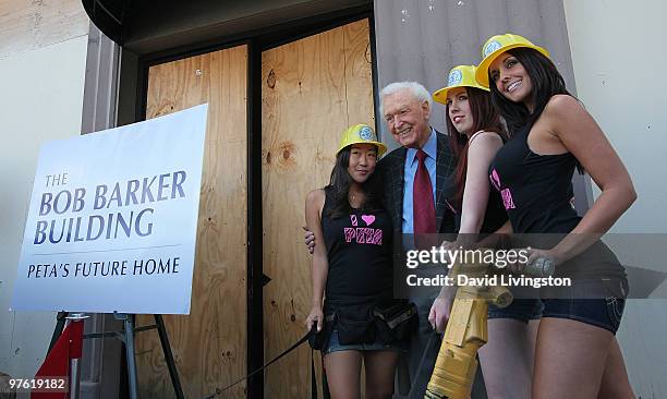 Personality Bob Barker poses with PETA models at the dedication ceremony for PETA's Los Angeles office "The Bob Barker Building" on March 10, 2010 in...