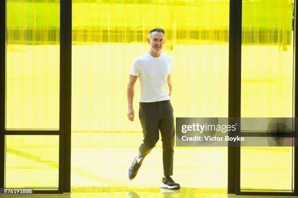 Designer Neil Barrett acknowledges the applause of the audience at the Neil Barrett show during Milan Men's Fashion Week Spring/Summer 2019 on June...