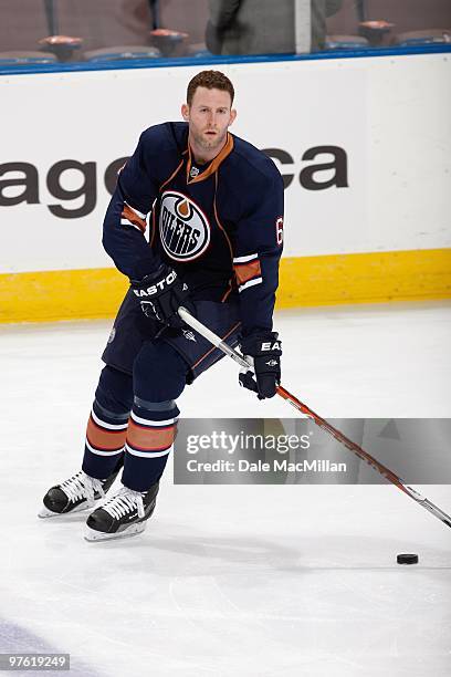 Ryan Whitney of the Edmonton Oilers warmes up before the game against the Minnesota Wild on March 5, 2010 at Rexall Place in Edmonton, Alberta,...