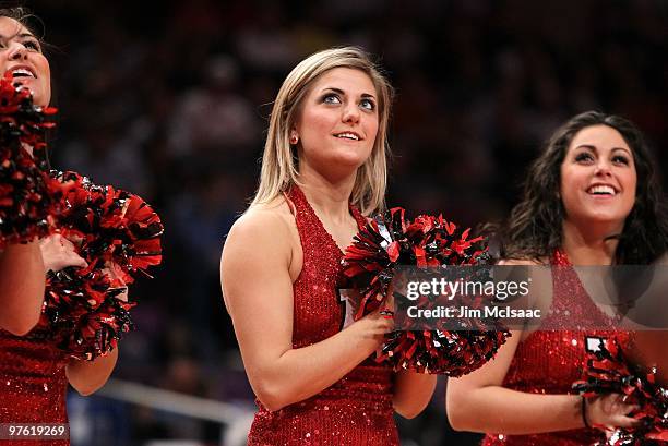 The Rutgers Scarlet Knights cheerleaders perform on court against the Cincinnati Bearcats during the first round game of the Big East Basketball...