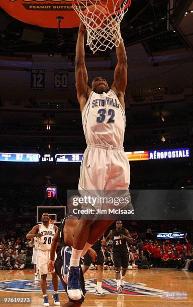 Jeff Robinson of the Seton Hall Pirates dunks the ball against the Providence Friars during the first round game of the Big East Basketball...