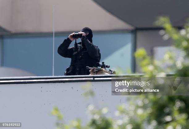 June 2018, Germany, Berlin: A sniper standing on the Federal Chancellery's rooftop during a visit by Benjamin Netanyahu, PM of Israel. Netanyahu met...