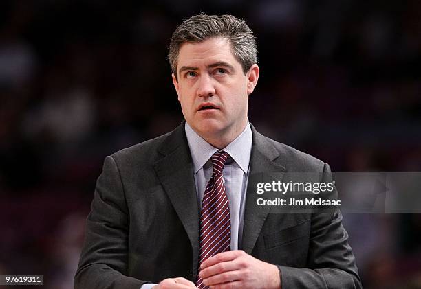 Head coach Keno Davis of the Providence Friars looks on from the bench against the Seton Hall Pirates during the first round game of the Big East...