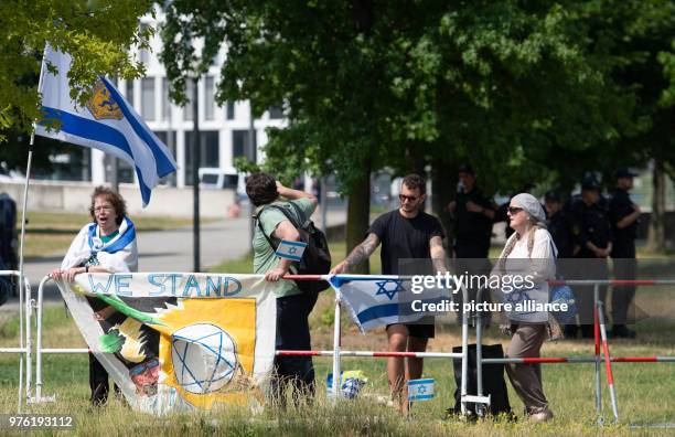 June 2018, Germany, Berlin: Pro-israeli demonstrators pictured not far from the Federal Chancellery, where Benjamin Netanyahu, PM of Israel, met with...