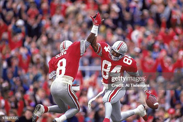 Ohio State Jeff Graham victorious, giving high five to teammate Bobby Olive after scoring touchdown vs Michigan. Columbus, OH CREDIT: Al Tielemans