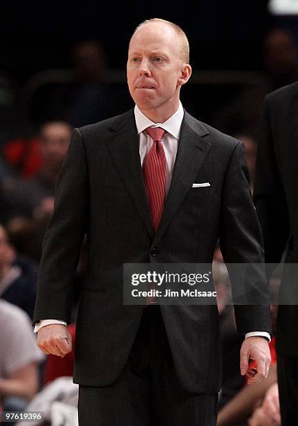 Head coach Mick Cronin of the Cincinnati Bearcats looks on from the bench against the Rutgers Scarlet Knights during the first round game of the Big...