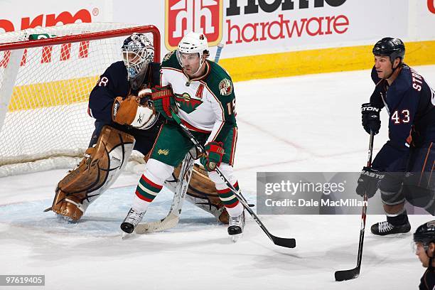 Andrew Brunette of the Minnesota Wild moves into position against goalie Jeff Deslauriers of the Edmonton Oilers on March 5, 2010 at Rexall Place in...